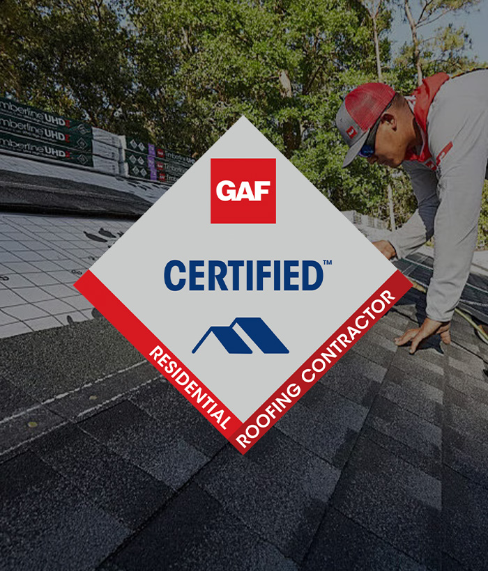 Roofer installing asphalt GAF shingles